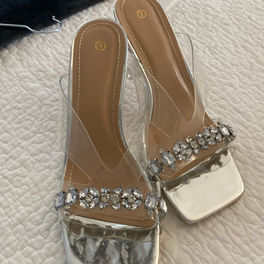 Clear acrylic dress shoes with rhinestones. Size 9. Worn for a wedding one time.